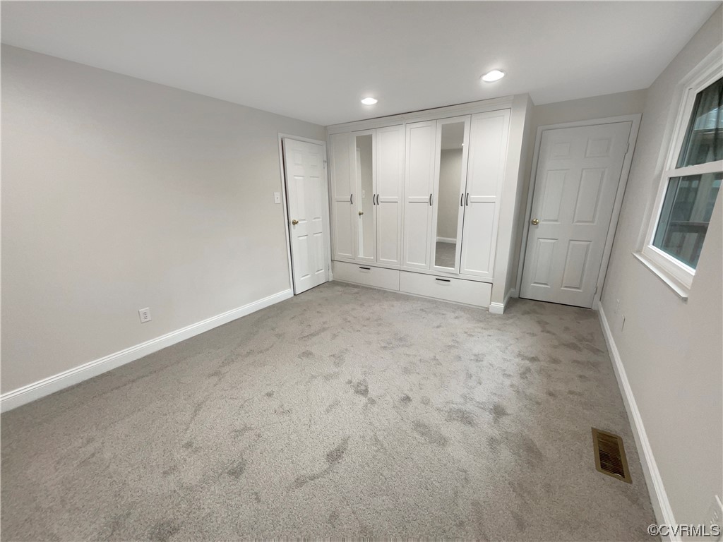 9407 Emmett Road Glen Allen, VA 23060 - Photo 12 of 18 an empty room with windows