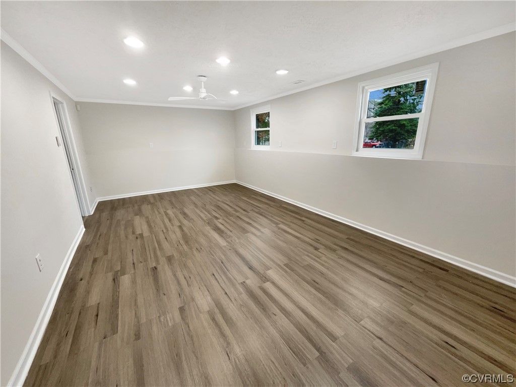 9407 Emmett Road Glen Allen, VA 23060 - Photo 15 of 18 an empty room with wooden floor and windows
