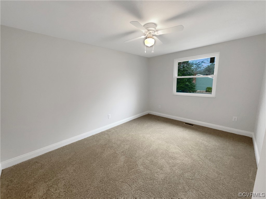 9407 Emmett Road Glen Allen, VA 23060 - Photo 5 of 18 an empty room with a window