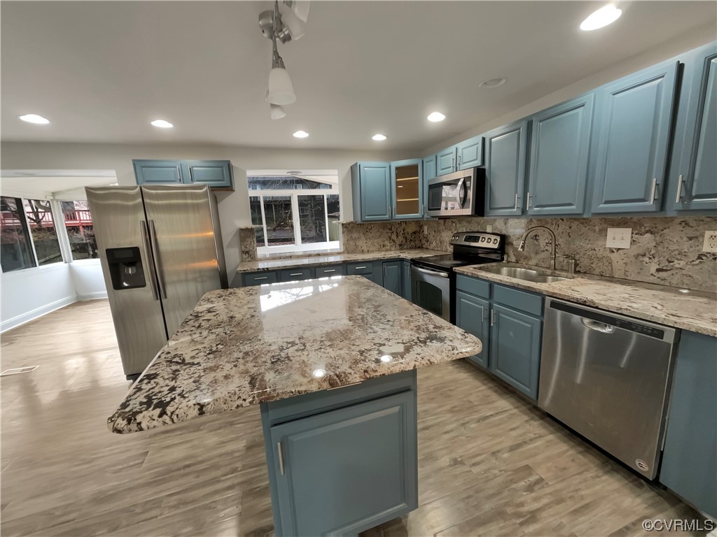 9407 Emmett Road Glen Allen, VA 23060 - Photo 6 of 18 a kitchen with stainless steel appliances granite countertop a sink stove and refrigerator