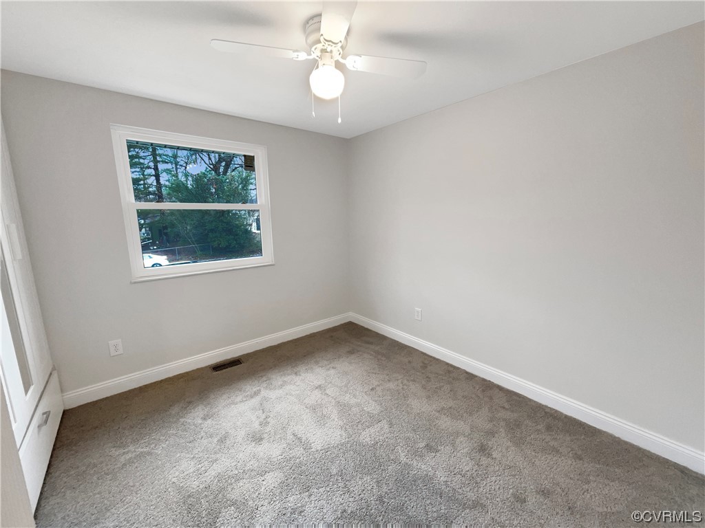 9407 Emmett Road Glen Allen, VA 23060 - Photo 9 of 18 an empty room with a window