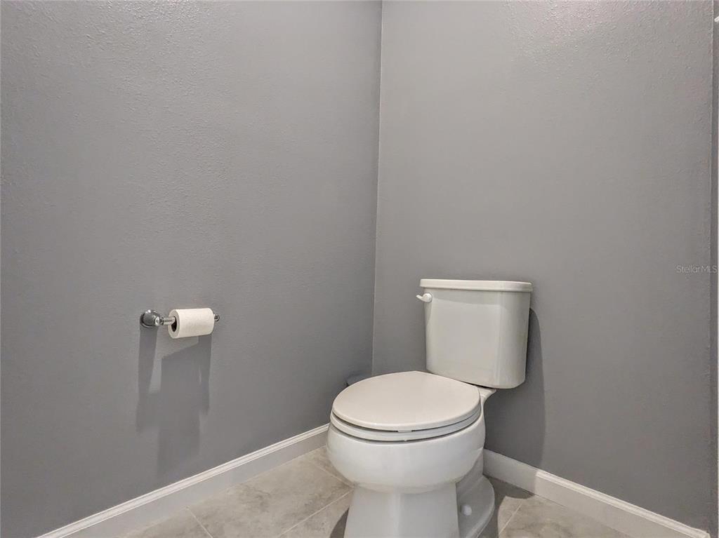 6205 114th Avenue East Parrish, FL 34219 - Photo 13 of 33 a white toilet sitting next to a white wall
