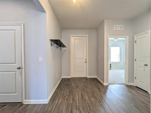 wooden floor & windows in a room