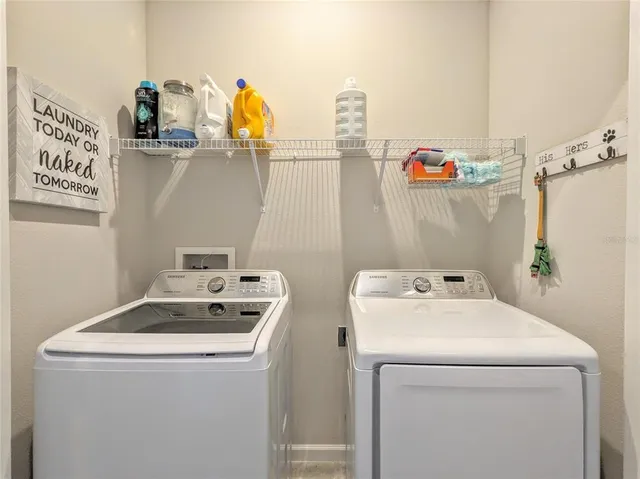 a utility room with dryer and washer