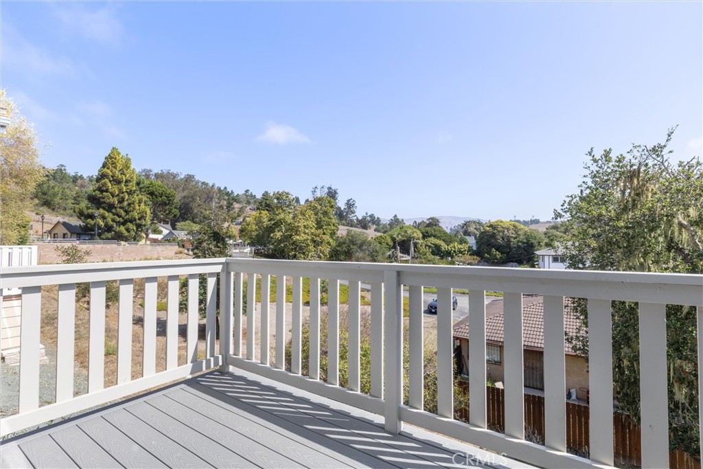 1460 Main Street, Unit 117 Cambria, CA 93428 - Photo 23 of 23 a balcony with wooden floor and fence