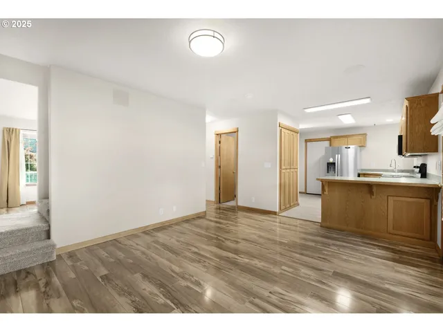 a view of kitchen with wooden floor