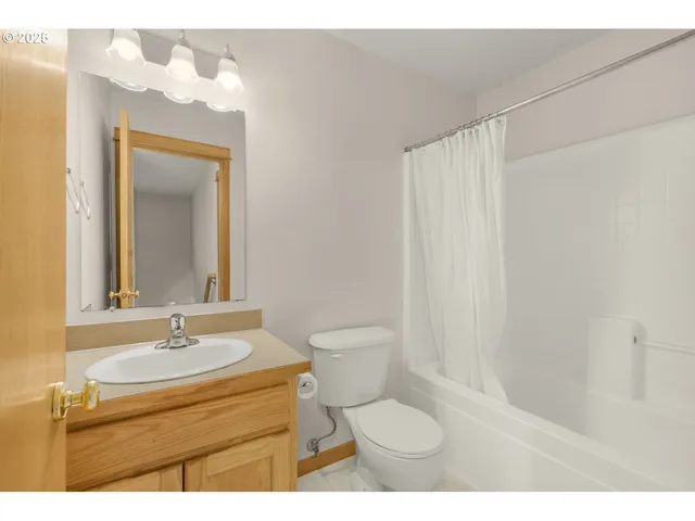 a bathroom with a sink vanity and a mirror