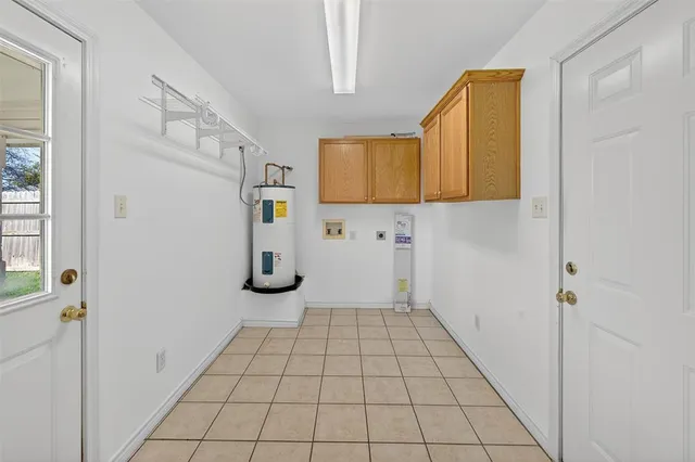 a view of a livingroom with wooden floor and cabinet