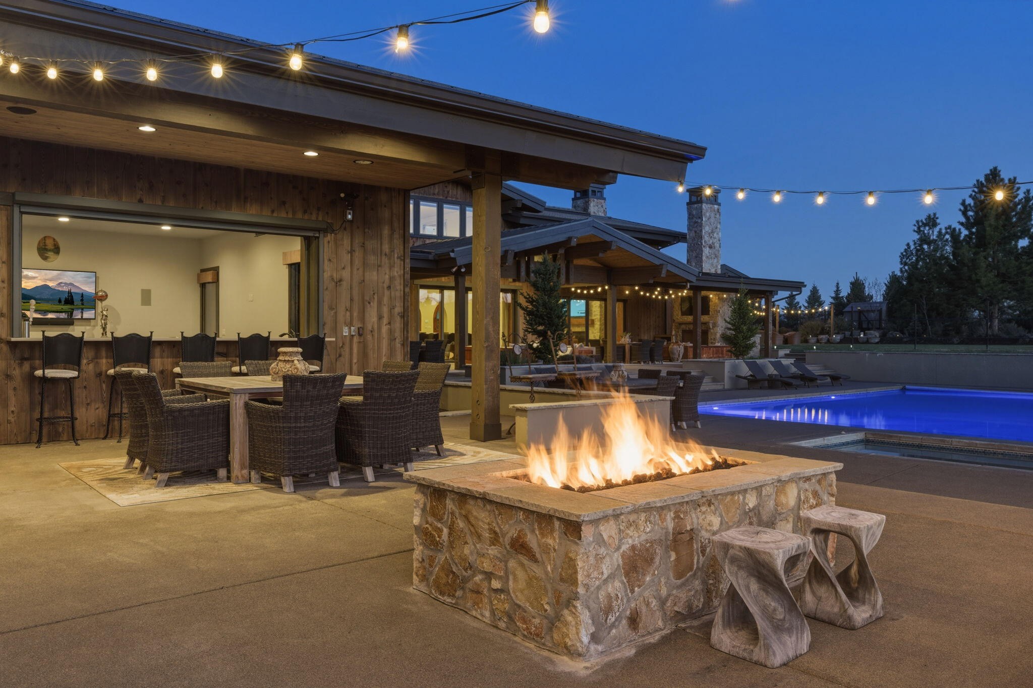 19100 Macalpine Loop Bend, OR 97702 - Photo 5 of 56 Pool & fire side evening - pool house bar