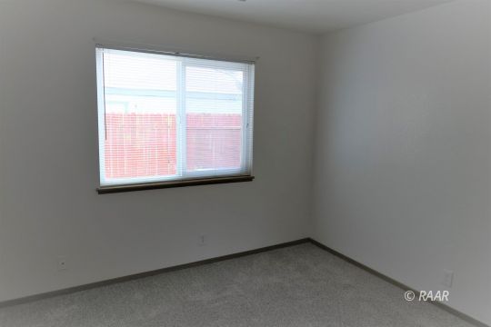 412 Veada Avenue Ridgecrest, CA 93555 - Photo 22 of 35 an empty room with a window