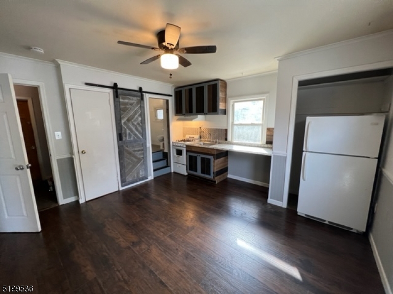 175 Green Pond Road, Unit C Rockaway, NJ 07866 - Photo 1 of 5 a view of a livingroom with furniture and a ceiling fan