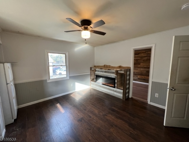 175 Green Pond Road, Unit C Rockaway, NJ 07866 - Photo 2 of 5 a view of livingroom with hardwood floor and a ceiling fan