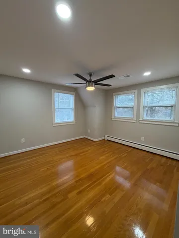 an empty room with a empty space and windows