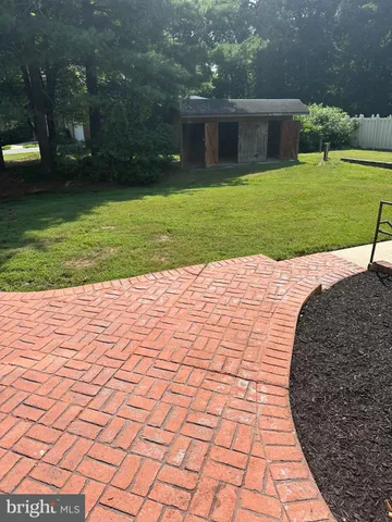 a house that has a big yard with large trees