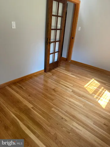 a view of wooden floor and windows in a yard