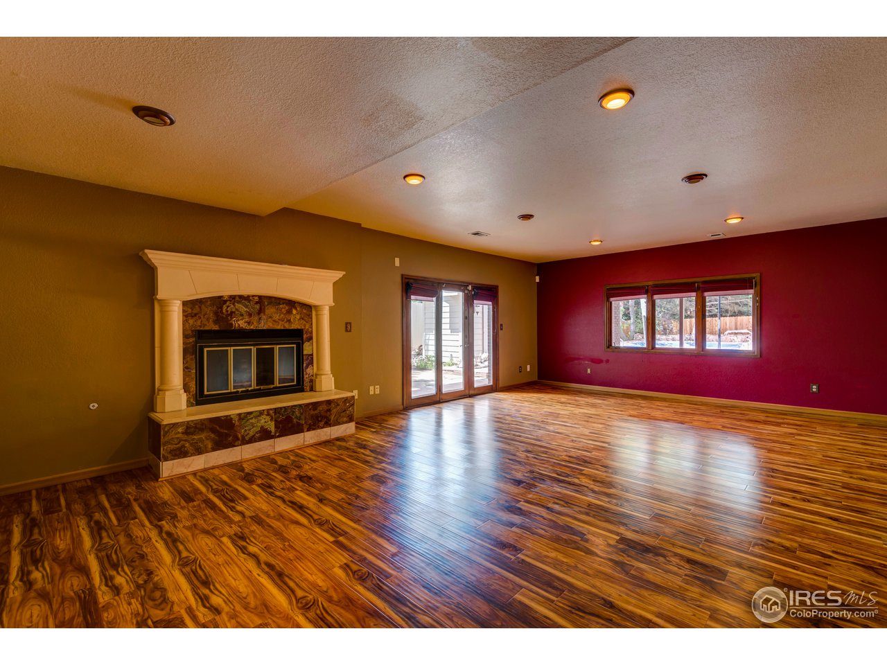 1909 Homestead Road Greeley, CO 80634 - Photo 12 of 38 Downstairs Living Room