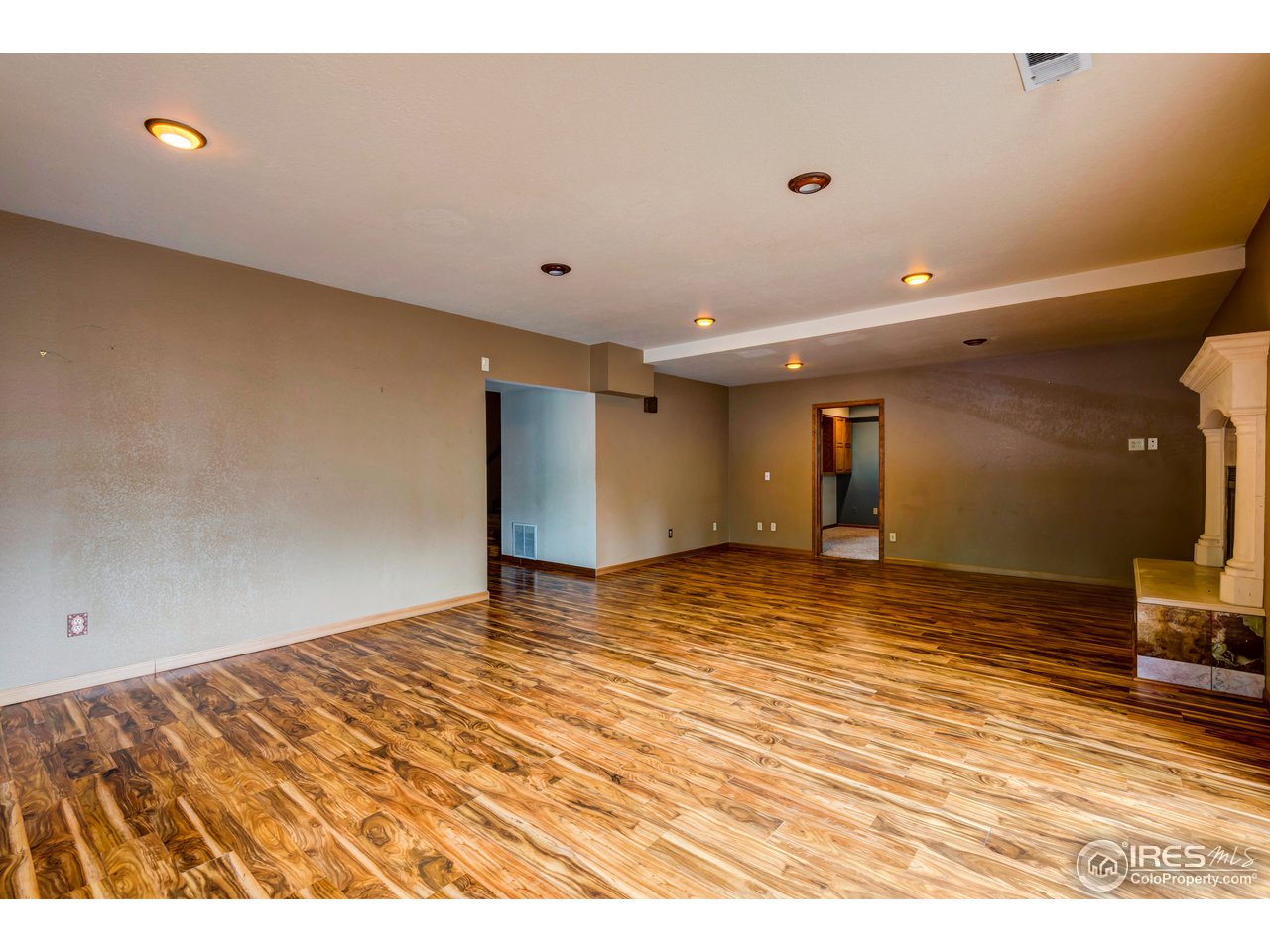 1909 Homestead Road Greeley, CO 80634 - Photo 13 of 38 Downstairs Living Room