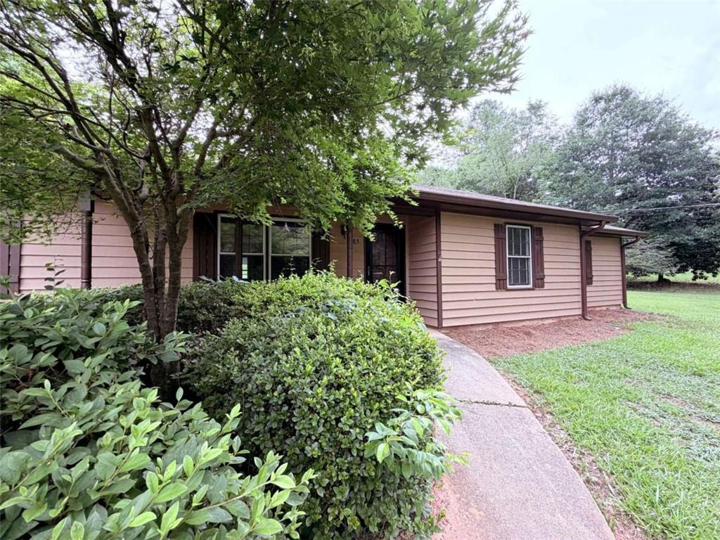 185 Roberts Road Covington, GA 30016 - Photo 4 of 25 a front view of a house with garden