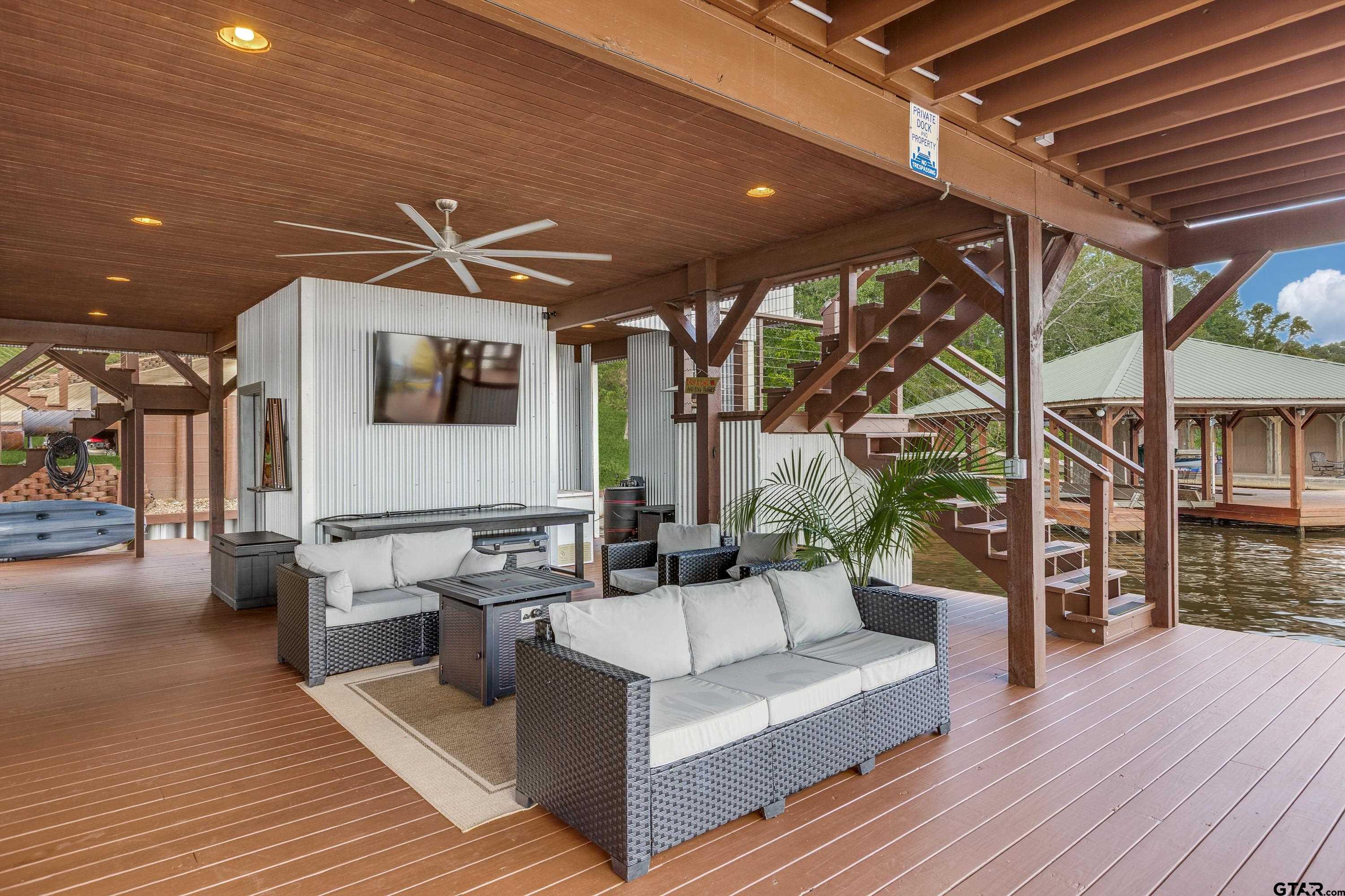16822 Perry Street Tyler, TX 75707 - Photo 13 of 45 a outdoor space with patio the couches and a dining table with wooden floor