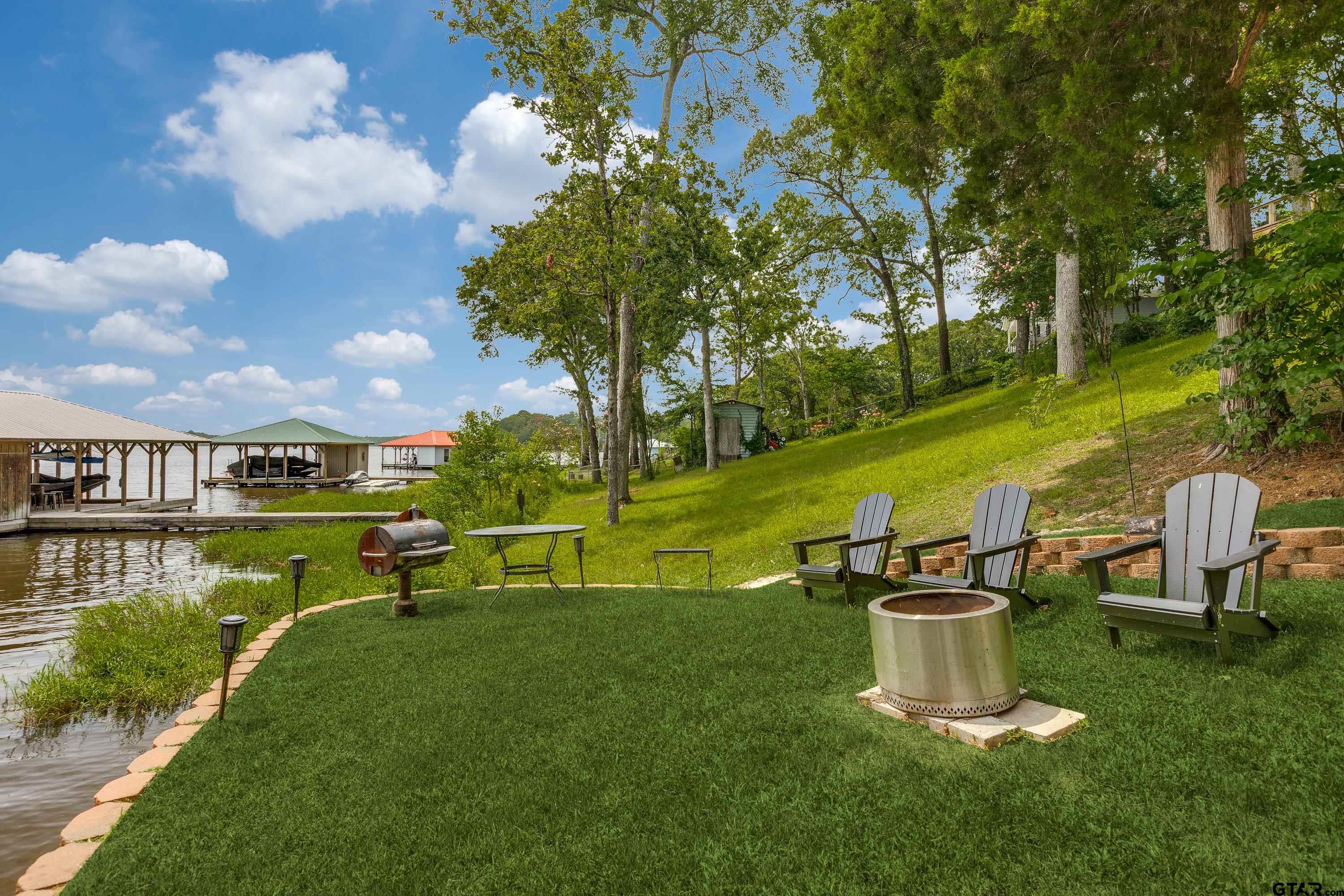 16822 Perry Street Tyler, TX 75707 - Photo 19 of 45 a view of a lake with a garden