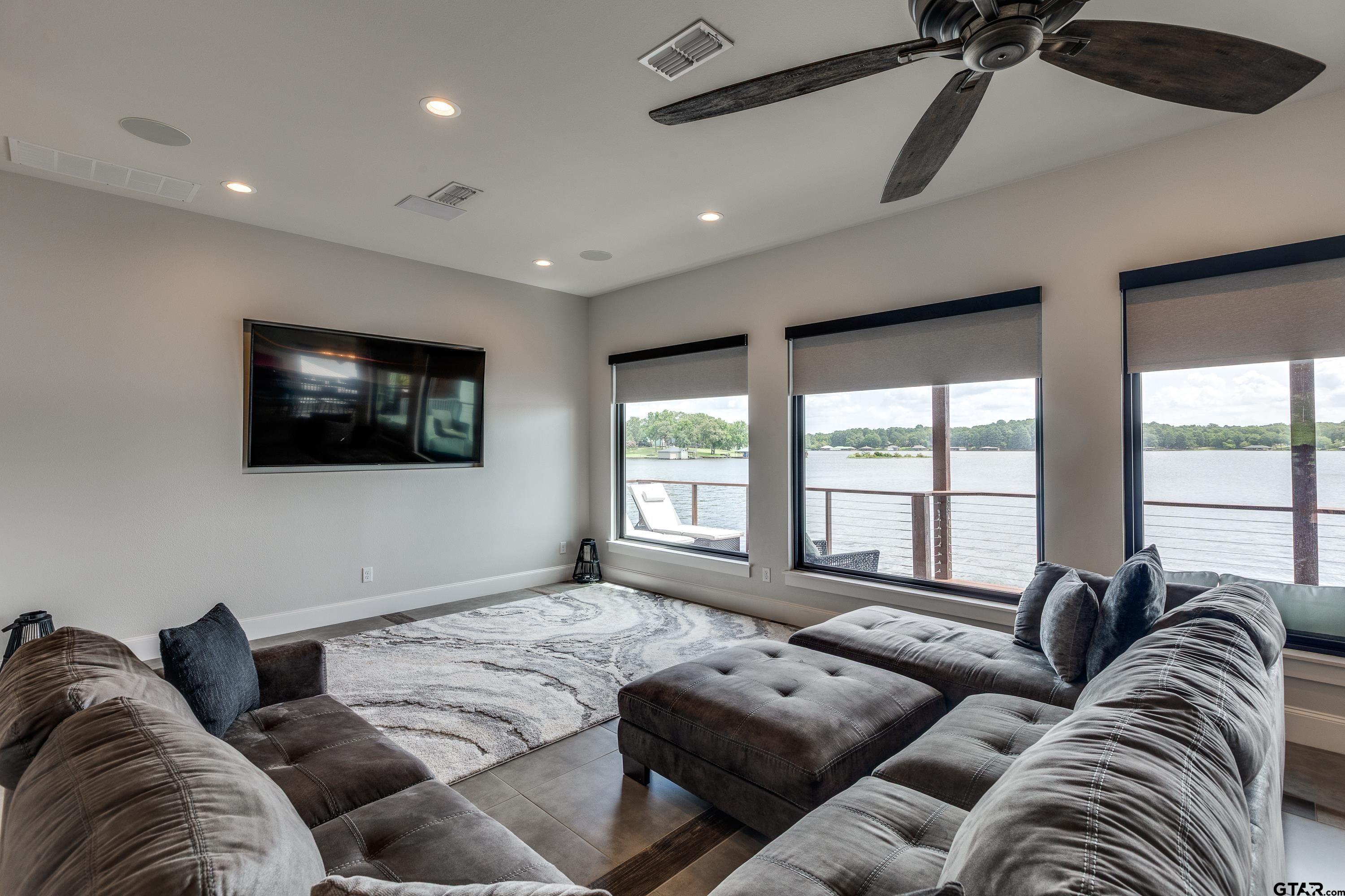 16822 Perry Street Tyler, TX 75707 - Photo 24 of 45 a living room with furniture and a flat screen tv