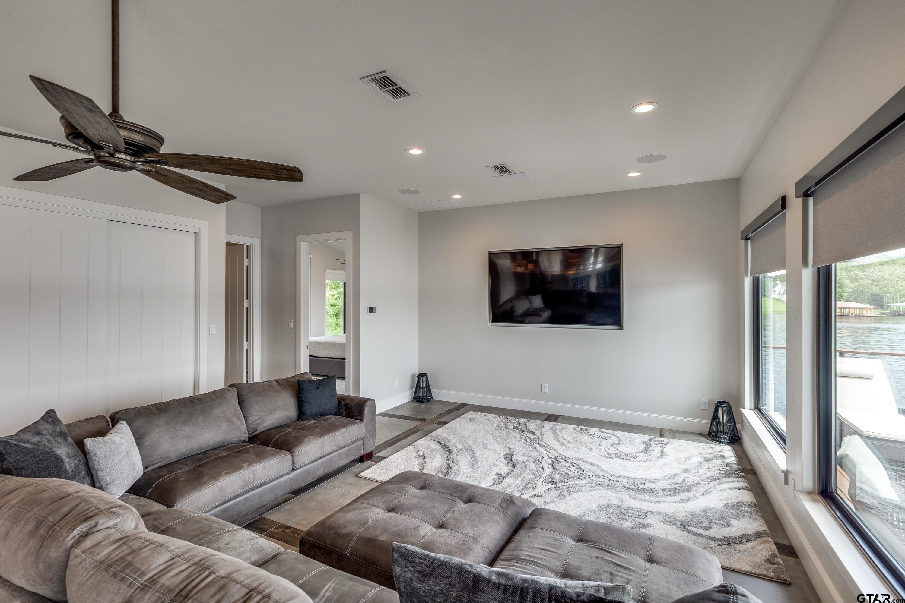 16822 Perry Street Tyler, TX 75707 - Photo 26 of 45 a living room with furniture and a flat screen tv