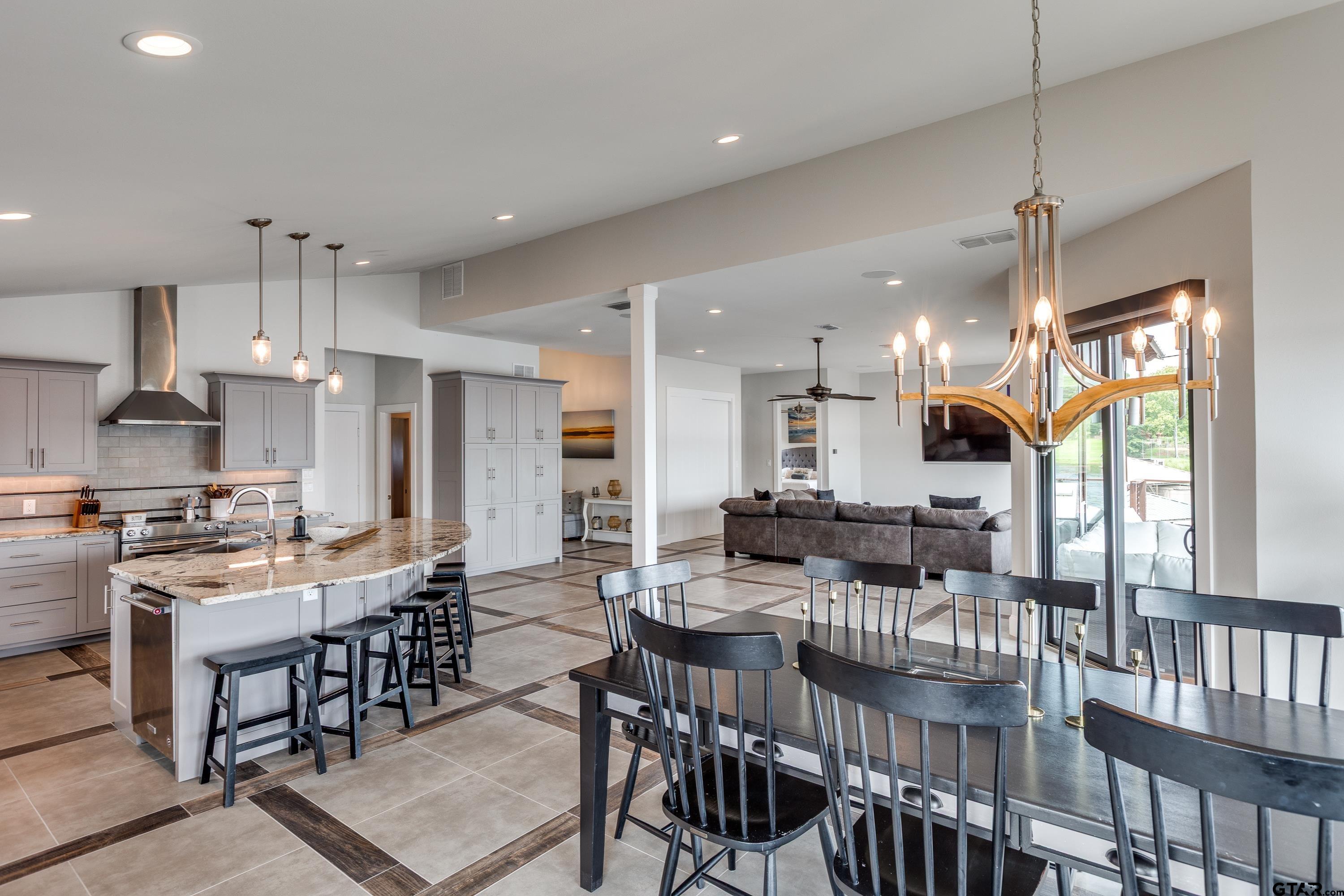 16822 Perry Street Tyler, TX 75707 - Photo 35 of 45 a large kitchen with a table and chairs