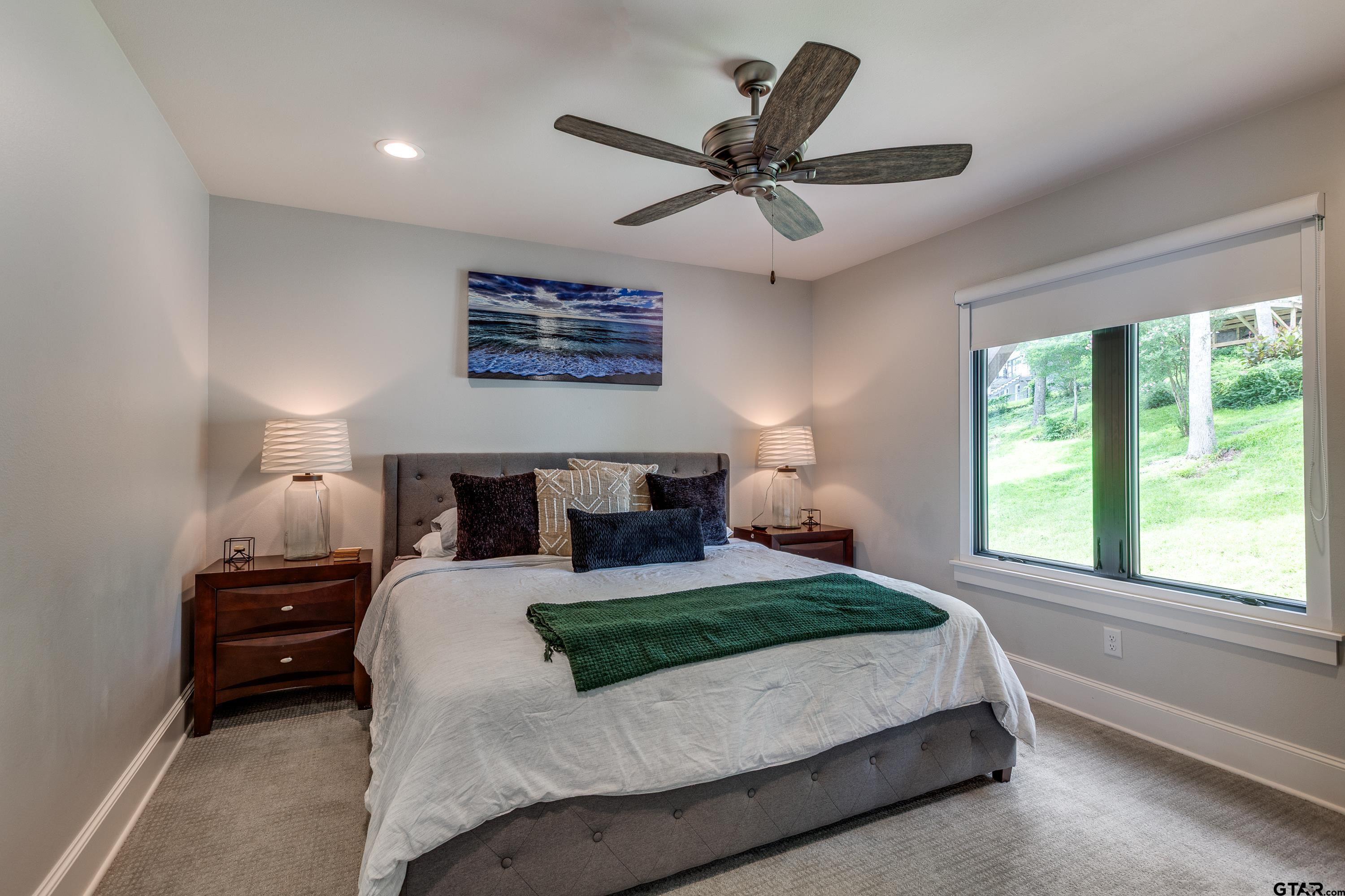 16822 Perry Street Tyler, TX 75707 - Photo 36 of 45 a bedroom with a large bed and a large window
