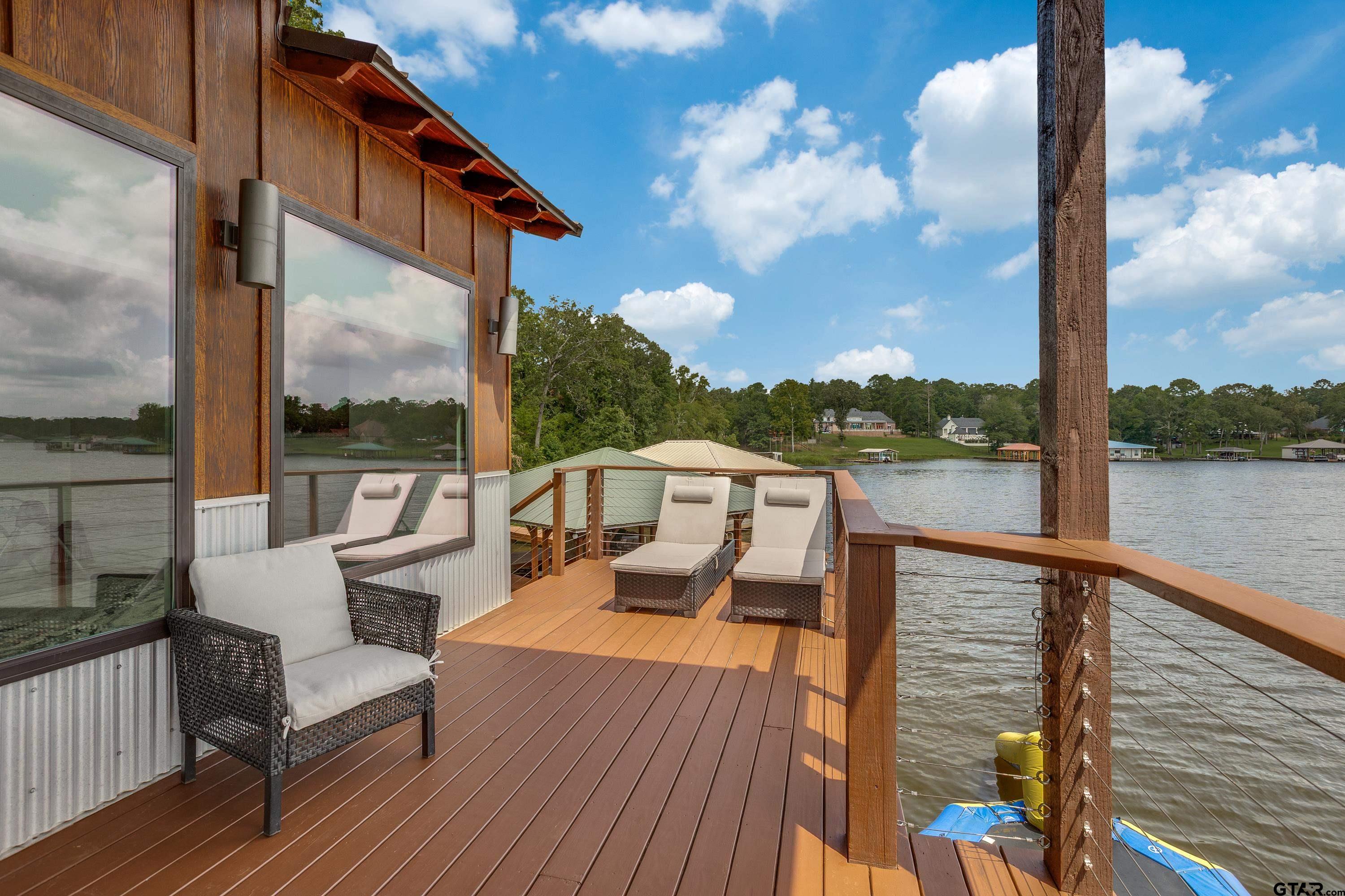 16822 Perry Street Tyler, TX 75707 - Photo 9 of 45 a view of a balcony with wooden floor and lake view