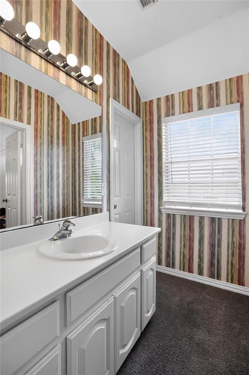 111 Ripplewood Coppell, TX 75019 - Photo 28 of 34 Vanity with integrated sink and single-handle faucet