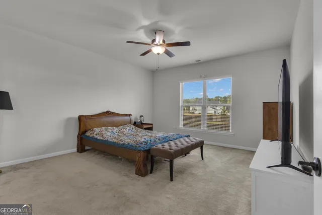 a bathroom with a double vanity sink mirror and shower