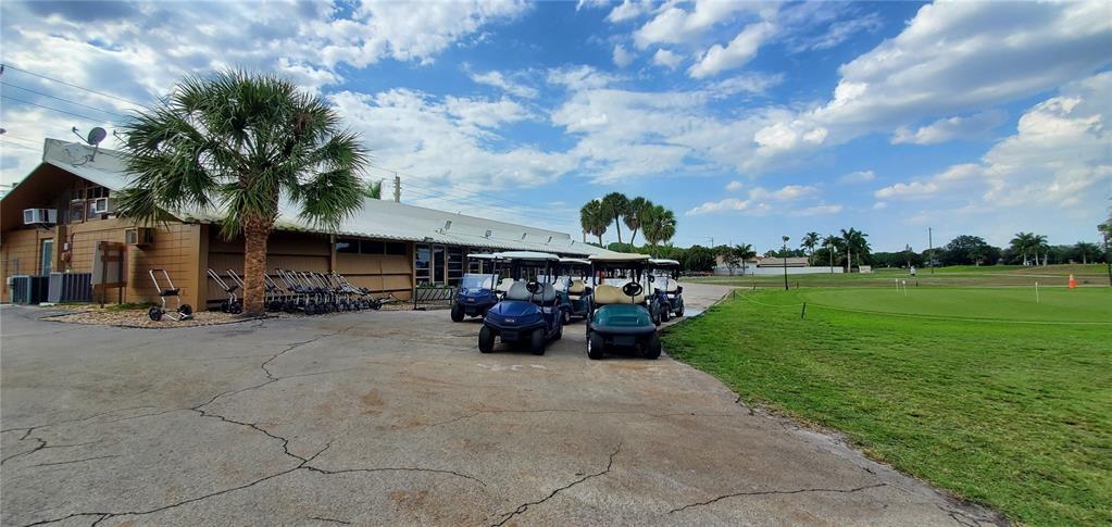 5100 Southwest 90th Avenue, Unit 406 Cooper City, FL 33328 - Photo 18 of 25 a view of a yard with cars parked in back yard