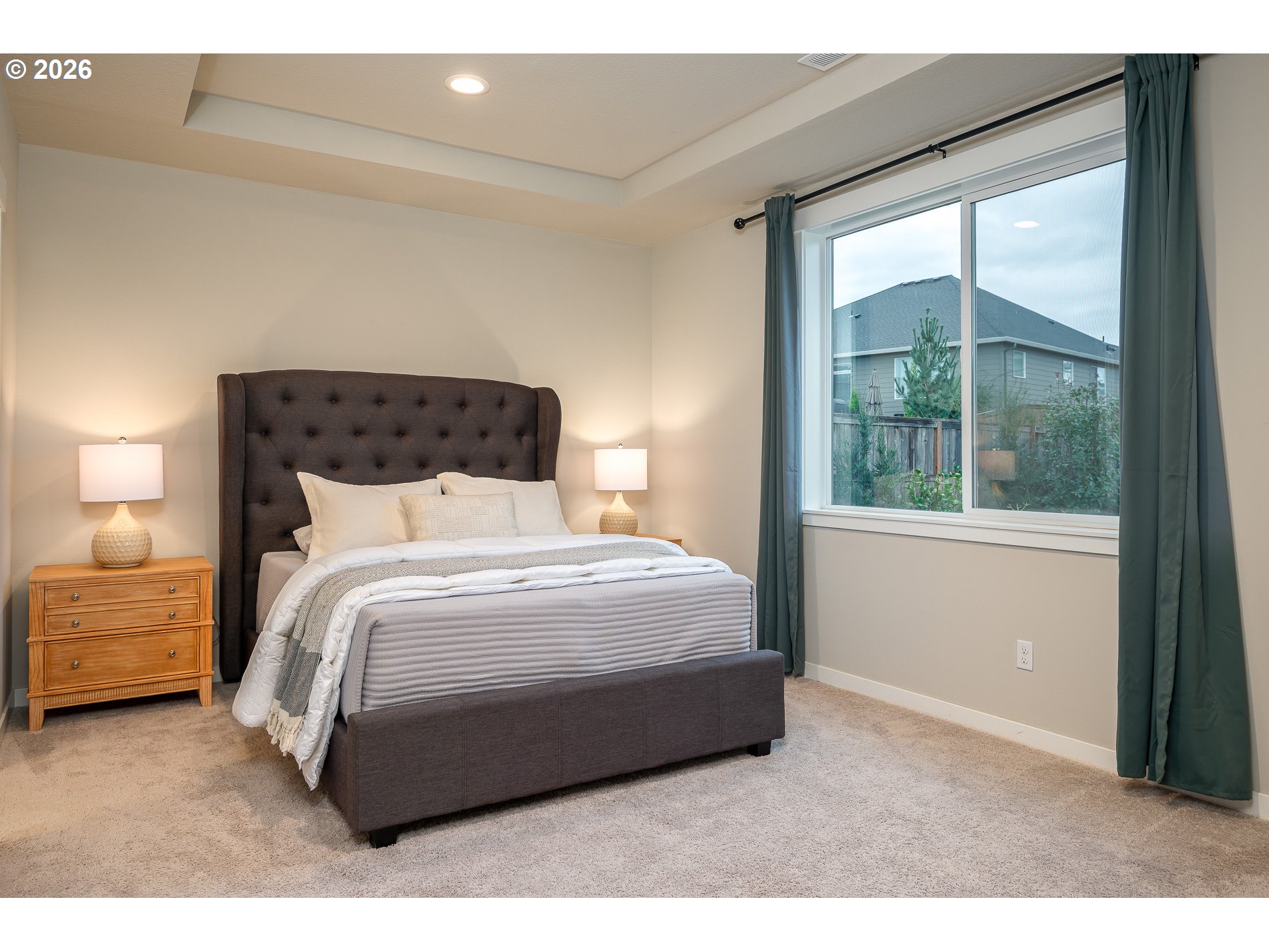 3606 Northeast Oriole Street Camas, WA 98607 - Photo 30 of 48 a bedroom with a bed lamp and a large window