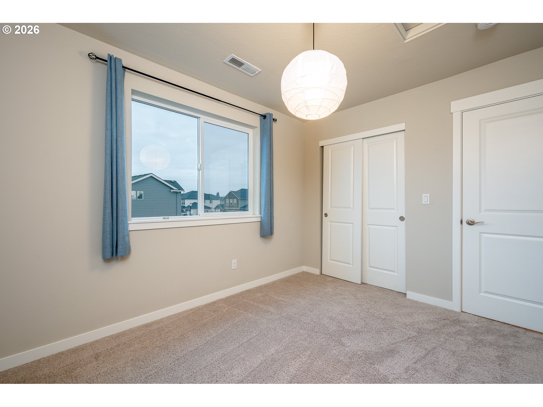 3606 Northeast Oriole Street Camas, WA 98607 - Photo 38 of 48 a view of an empty room with wooden floor and windows