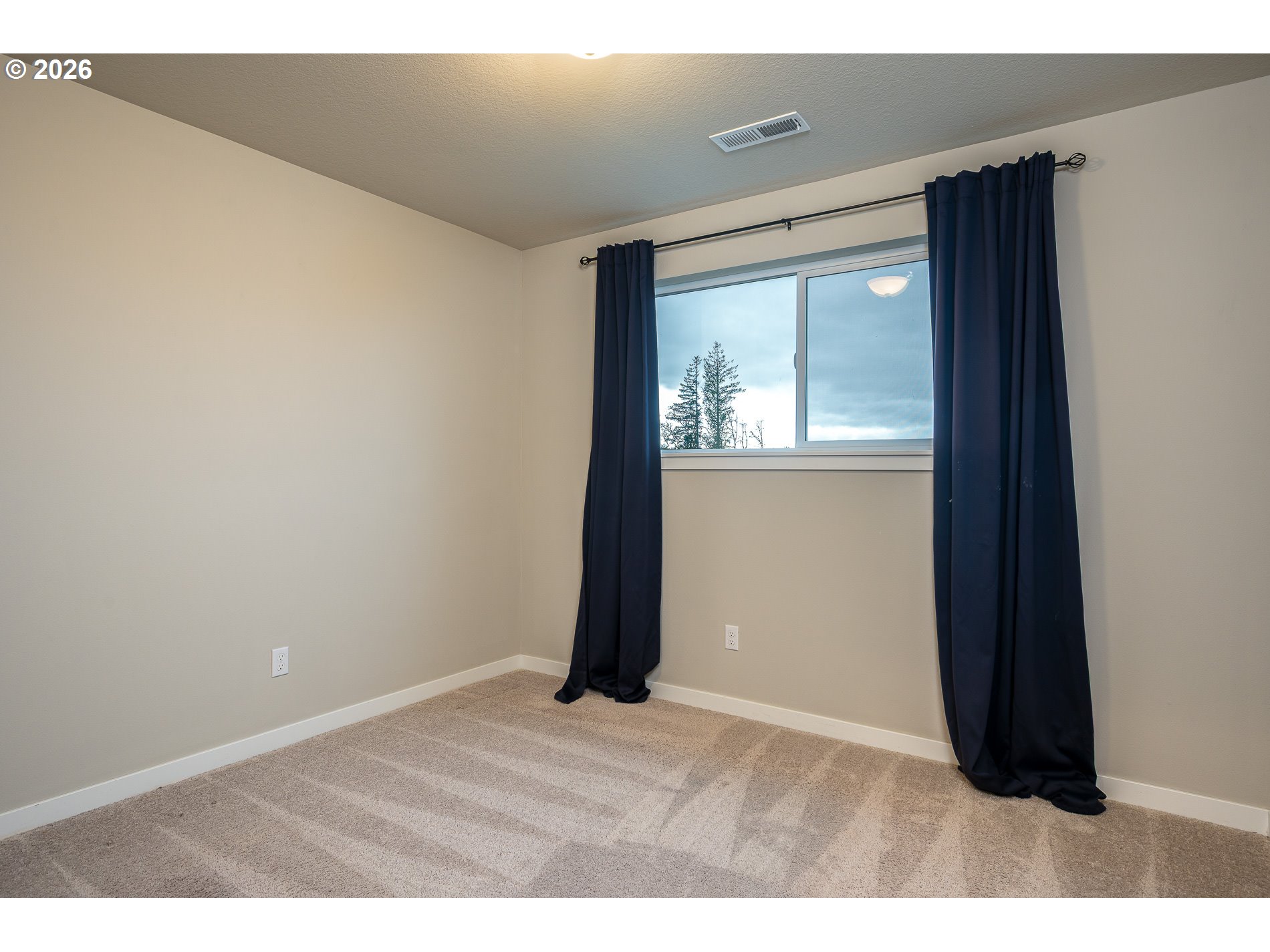 3606 Northeast Oriole Street Camas, WA 98607 - Photo 42 of 48 a view of an empty room with wooden floor and a window