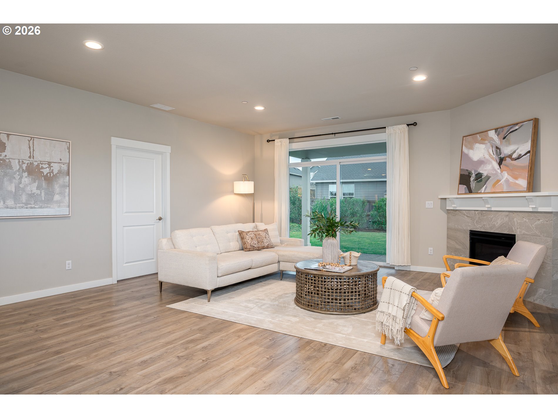 3606 Northeast Oriole Street Camas, WA 98607 - Photo 45 of 48 a living room with furniture a large window and a fireplace