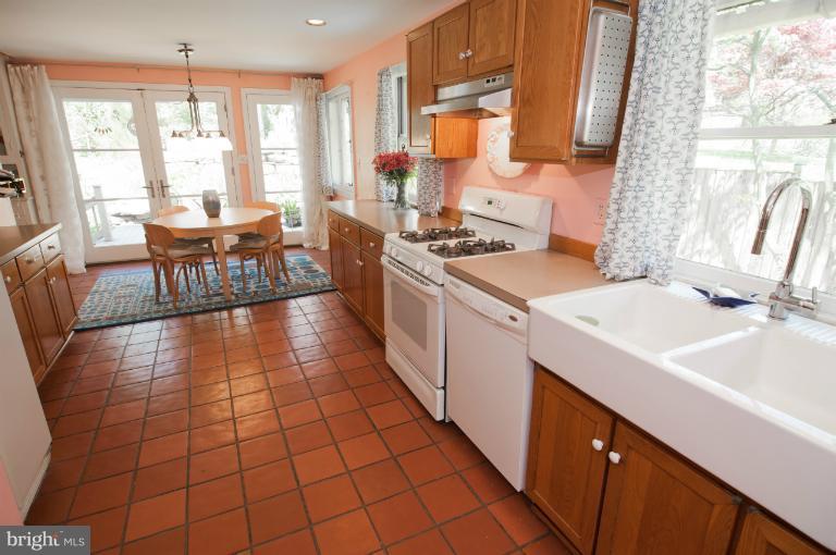 8 St Johns Road Baltimore, MD 21210 - Photo 2 of 18 a kitchen with a sink stove and cabinets