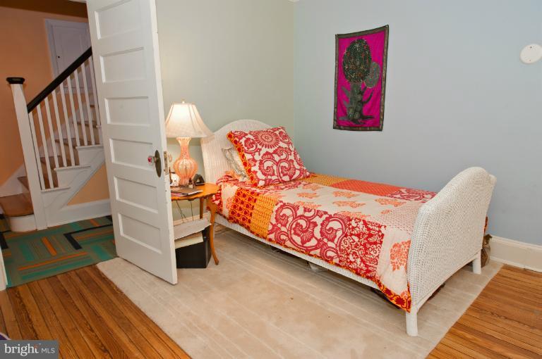 8 St Johns Road Baltimore, MD 21210 - Photo 12 of 18 a bed room with a bed and a chair
