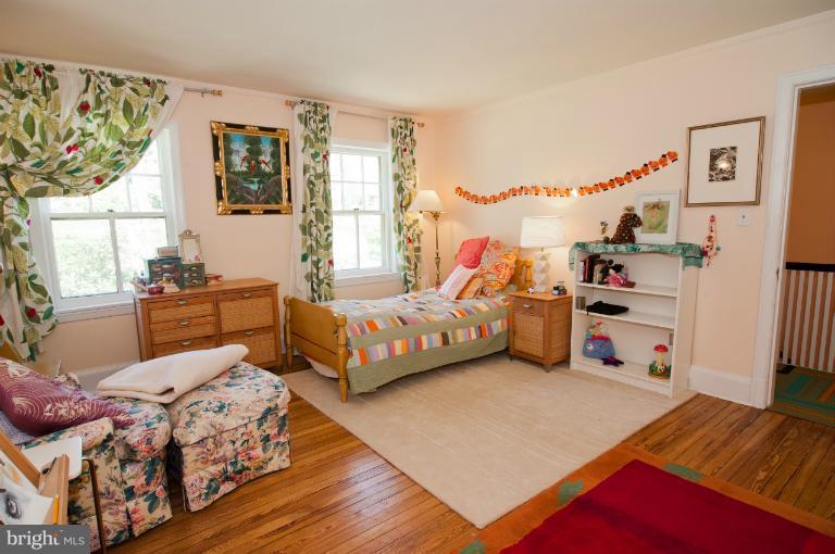 8 St Johns Road Baltimore, MD 21210 - Photo 8 of 18 a bedroom with furniture and a large window