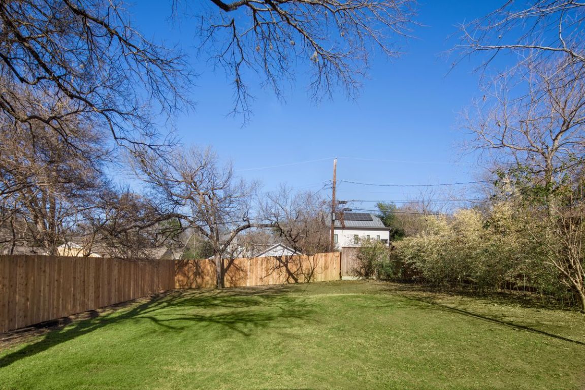 1704 Northwood Road Austin, TX 78703 - Photo 17 of 22 a backyard of a house with lots of green space