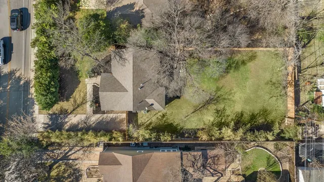 an aerial view of residential house with outdoor space