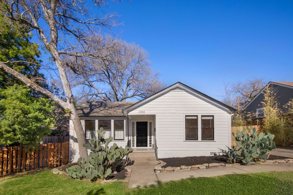 1704 Northwood Road Austin, TX 78703 - Photo 2 of 22 a front view of a house with garden
