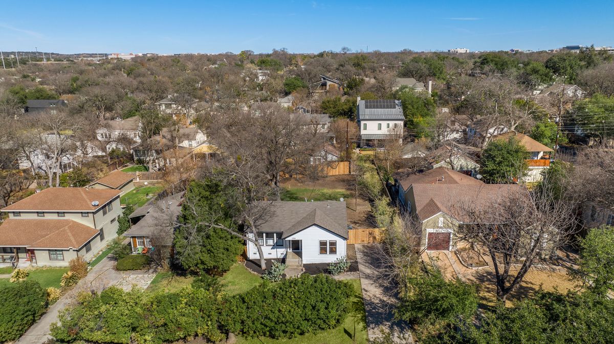 1704 Northwood Road Austin, TX 78703 - Photo 21 of 22 an aerial view of a house with a mountain in front of it