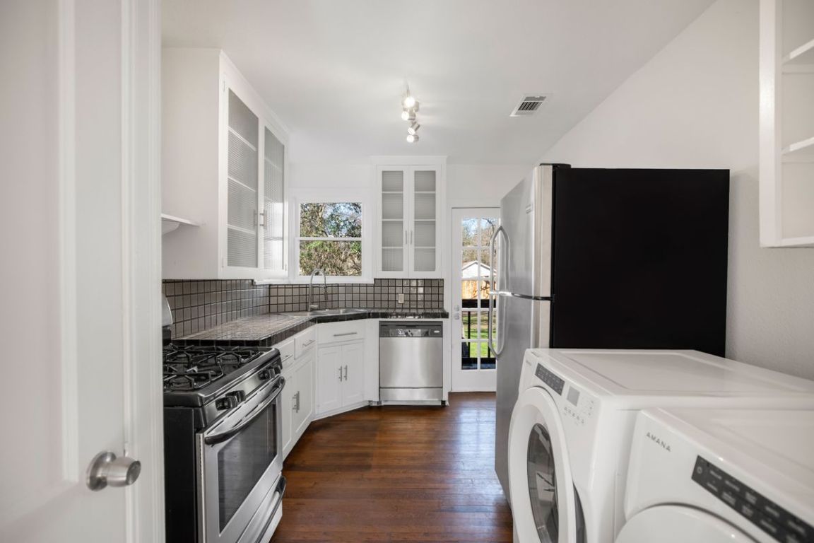 1704 Northwood Road Austin, TX 78703 - Photo 8 of 22 a kitchen with a stove and a refrigerator