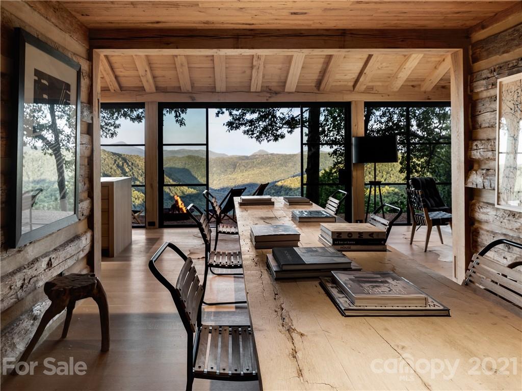 318 Summer Haven Lane Saluda, NC 28773 - Photo 12 of 40 a living room with furniture tv and a large window