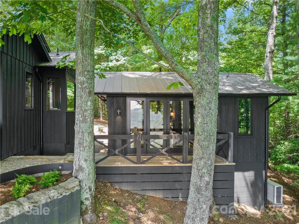 318 Summer Haven Lane Saluda, NC 28773 - Photo 23 of 40 a front view of a house with garden