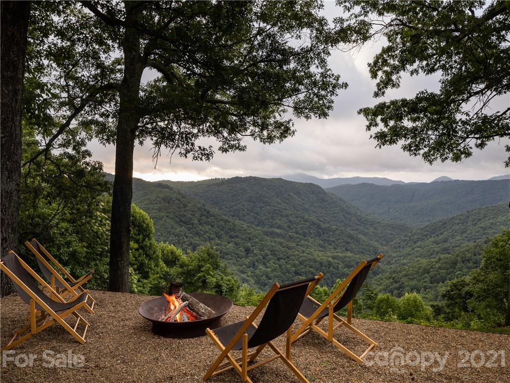 318 Summer Haven Lane Saluda, NC 28773 - Photo 24 of 40 a view of a chairs and table in the patio