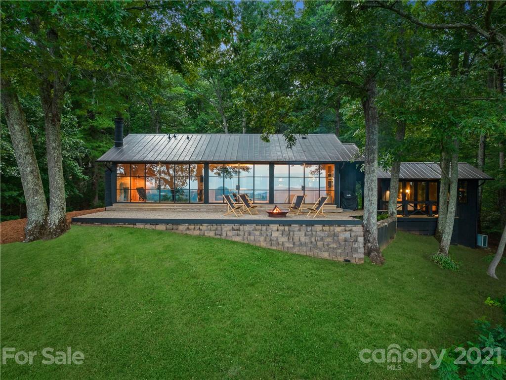 318 Summer Haven Lane Saluda, NC 28773 - Photo 28 of 40 a view of house with backyard and a garden