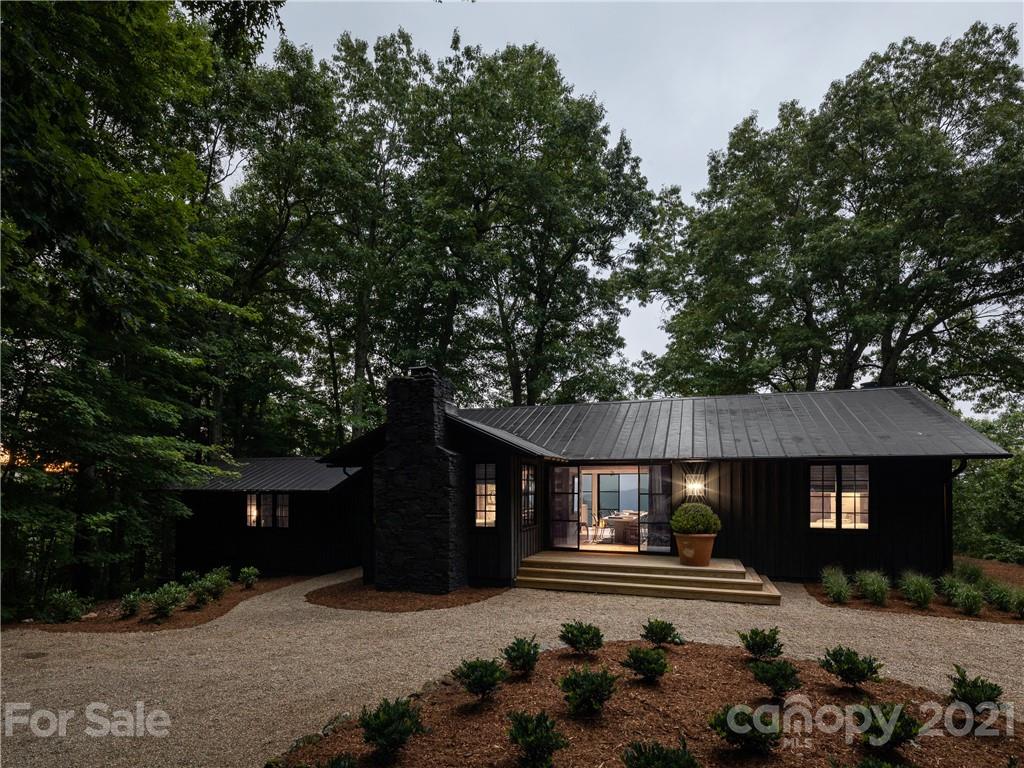 318 Summer Haven Lane Saluda, NC 28773 - Photo 4 of 40 a front view of a house with a yard