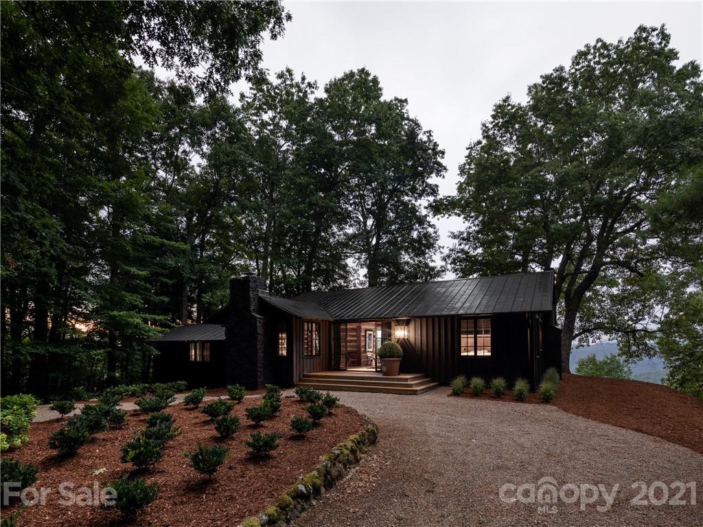 318 Summer Haven Lane Saluda, NC 28773 - Photo 33 of 40 a front view of a house with a yard and tree s